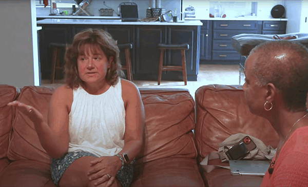 Image of Ann W. Jackson interviewing Brandon's long-term speech therapist within his home.