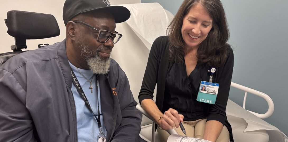 Sarah Ushkow explaining an authorization form to a patient.